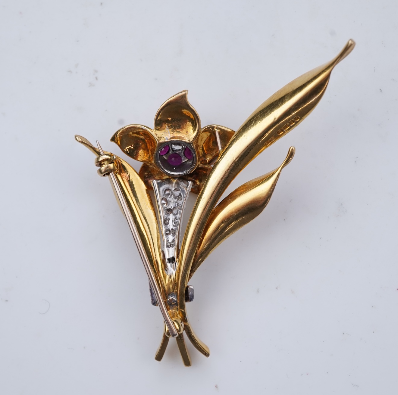 A gold, ruby and diamond brooch, circa 1966